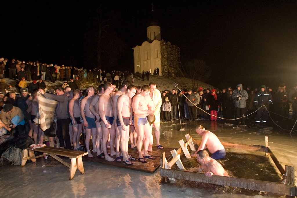 Russians celebrate Epiphany taking ice-cold midnight dip to wash away sins