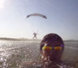 Swimmer plays Chicken with a paraglider