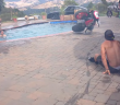 Show-off Crashes Motorcycle Into Swimming Pool Doing Wheelie