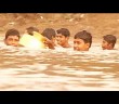 To school, here, involves daily swim for young Gujaratis