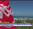 Men use boogie boards to rescue swimmer