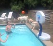 Behold this epic dog-assisted swimming pool dunk