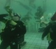 Christmas divers drink champagne at the bottom of swimming pool in Russia