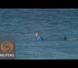 Pro surfer Fanning beats off shark attack live on TV