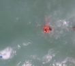 Watch as a â€˜lifeguard droneâ€™ rescues a swimmer struggling at sea