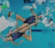 Mesmerising synchronised swimmers perform in plastic-littered pool Mesmerising synchronised swimmers perform in plastic-littered pool