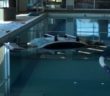 Car crashes into health clubâ€™s indoor pool, injures swimmer