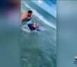 Boy escapes close encounter with shark thanks to police officer