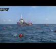 Migrants jump overboard from NGO vessel to swim to Sicily coast