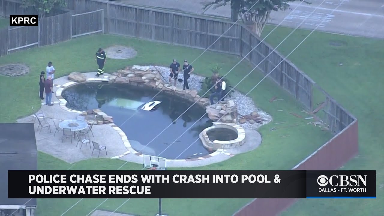 Texas Police Chase With Carjacking Suspect Ends With Crash Into Swimming Pool & Underwater Rescue | CBS Local News