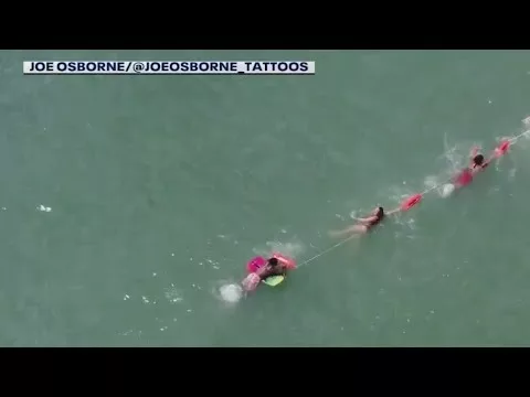 Drone Shows Lifeguards Rescuing Swimmer | FOX 35 Orlando